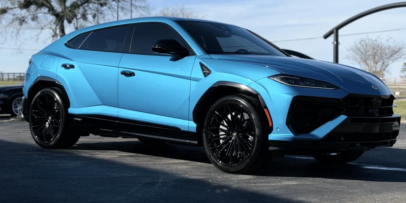 Electric blue luxury SUV parked outside after a full auto detailing service in College Station