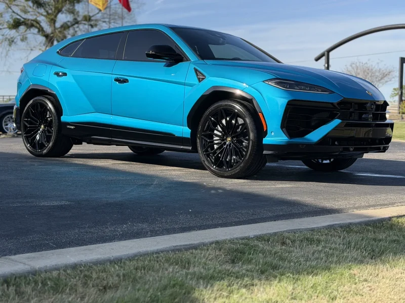 Bright blue SUV parked outside showcasing dark window tinting Navasota TX