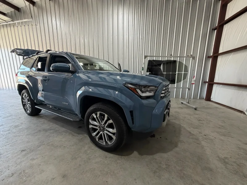 Grey Toyota Tacoma pickup truck with fresh window tinting College Station area