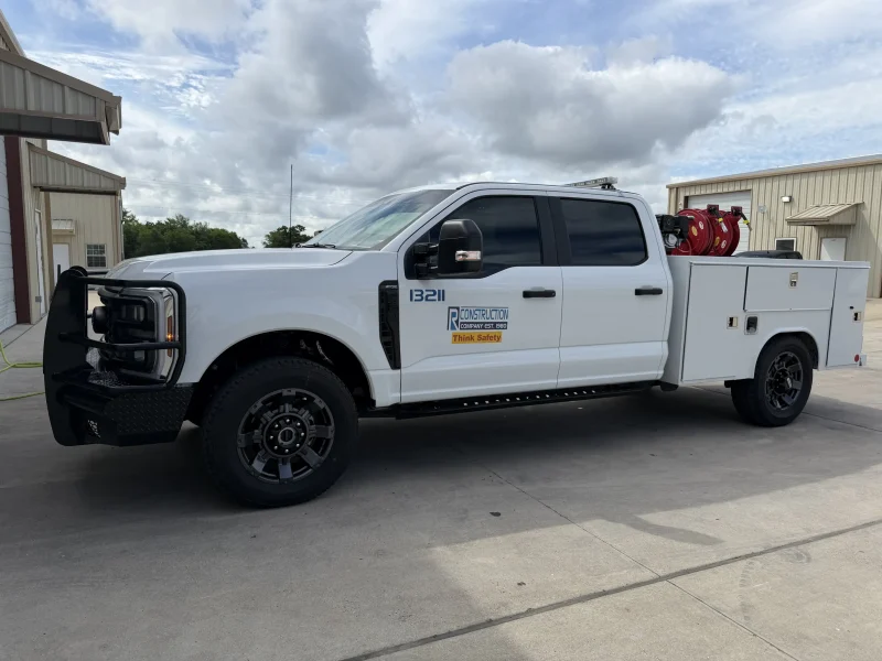 White commercial Ford pickup truck featuring window tinting College Station area