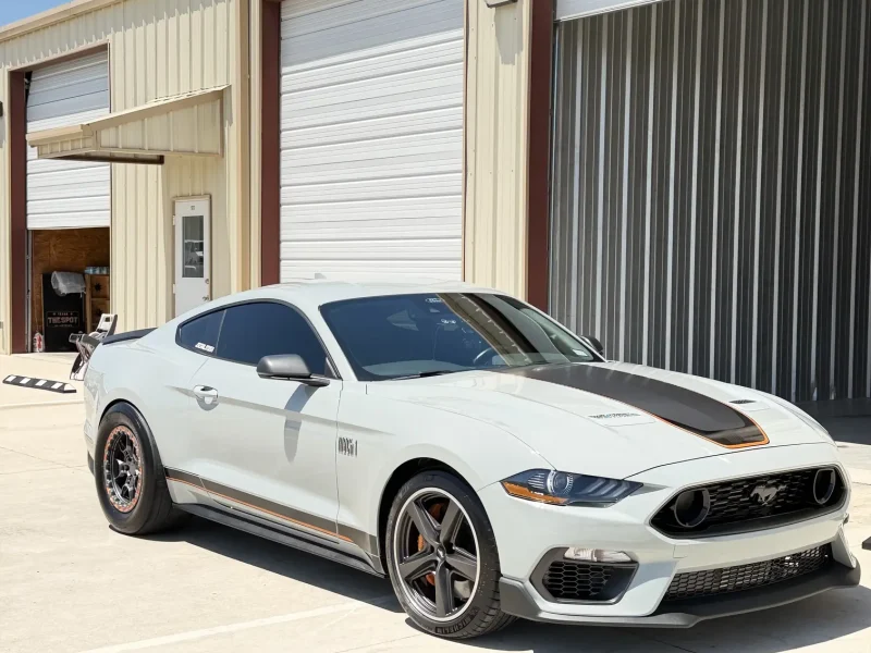 White Ford Mustang with dark side window film installed in the window tinting College Station area