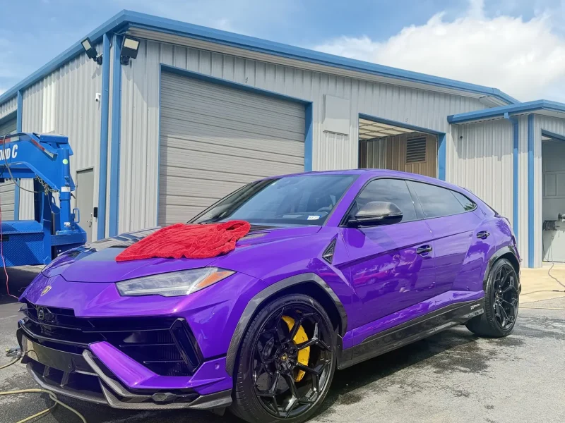Purple Lamborghini SUV parked outdoors with window tinting Navasota TX